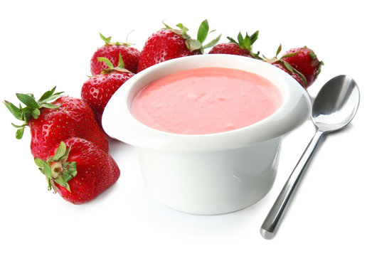 Homemade strawberry yogurt in bowl on white background