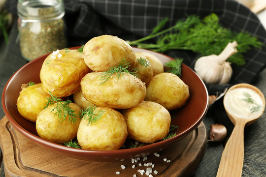 Composition with boiled potatoes on table, closeup