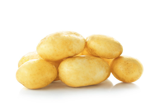 Organic raw potatoes on white background