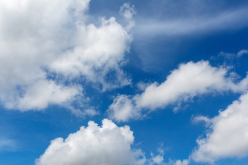 white summer clouds and intense blue sky