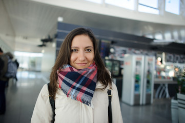 Young woman in the airport waiting room.