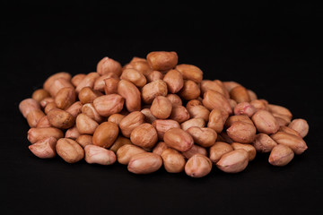 ground nut or peanut on black background