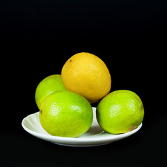 green lime and yellow lime  on black background