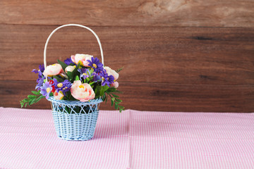 Fototapeta na wymiar flower in basket on wood background.