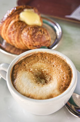 Italian cappuccino and croissant with copy space