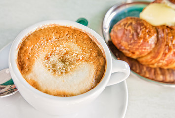 Italian cappuccino and croissant with copy space