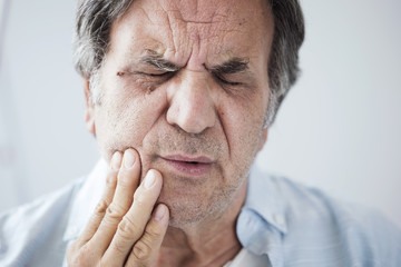 Old man with toothache