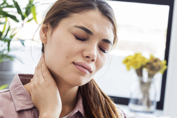 Young woman with neck pain