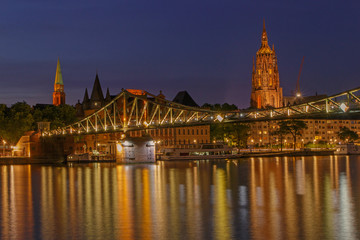 view on footbridge and old center of Frankfurt am Main at night