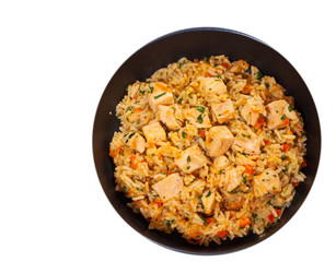 Chicken Breast with Rice and vegetables in a frying pan. top view. isolated on white
