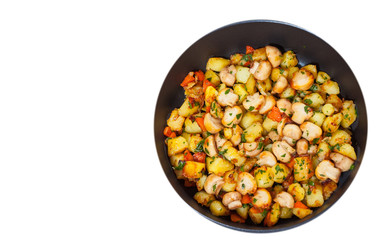Fried potato with mushrooms in a frying pan. top view. isolated on white