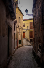 Fototapeta na wymiar Narrow street in Mediterranean town during Siesta