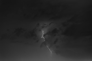 Lightning bolts against the backdrop of a thundercloud.