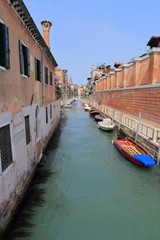 Fototapeta na wymiar Venice - April 10, 2017: The view on Canal in Venice, on April 10, 2017 in Venice, Italy