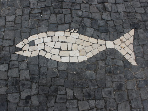 Mosaic in the form of fish on the sidewalk. The island of San Miguel. Azores