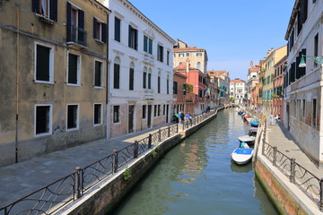Obraz na płótnie Canvas Venice - April 10, 2017: The view on Canal in Venice, on April 10, 2017 in Venice, Italy