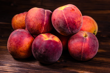 Fresh ripe peaches on wooden table