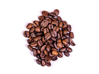 Pile of the roasted coffee beans isolated on white. Top view
