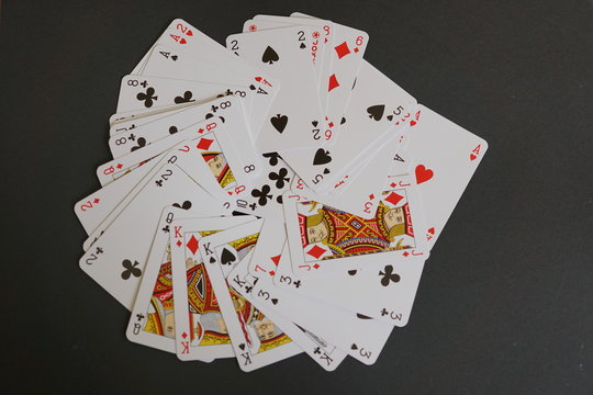 Deck of playing card spread out on a table