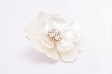 Brooch flower with pearls isolated on white