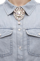 Brooch with crystals on the shirt isolated on white