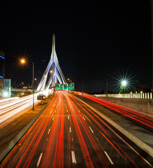 Fototapeta na wymiar Long exposure of traffic crossing the Zakim bridge at night