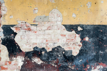 Old brickwork with plaster background in yellow and black