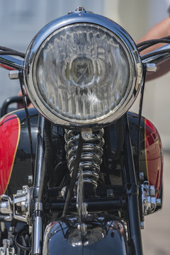A headlight in a vintage motorcycle