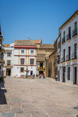 Cordoba, Spain - June 20 : A lone person walking on the streets of Cordoba on June 20, 2017.