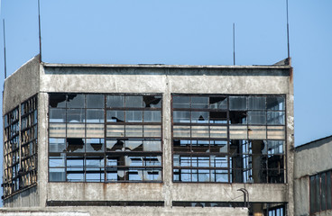 Abandoned and crumbling vintage obsolete industrial building