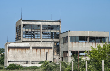 Abandoned and crumbling vintage obsolete industrial building