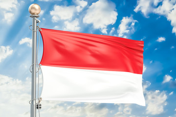 Indonesia flag waving in blue cloudy sky, 3D rendering