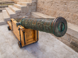 Old medieval artillery cannon with wooden stand in Komiza city on the Island Vis. Croatia.