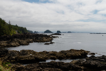 Remote coastal view with islands, cliffs and clouds