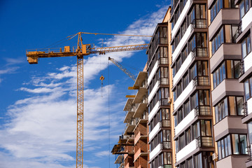 apartment building on blue sky background © Vitaliy Hrabar