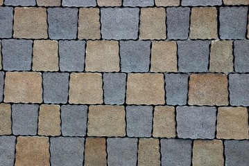 Obraz premium текстура из фрагмента цветной квадратной тротуарной плитки на дороге 