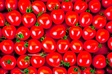 A lot of fresh red tomato together