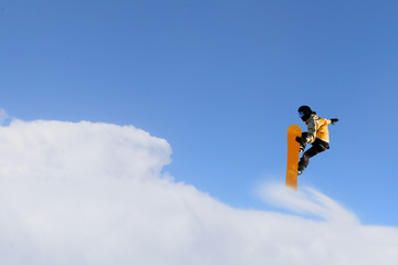 Snowboarder making jump