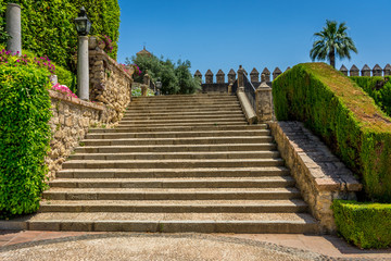 Fototapeta na wymiar Spanish steps in royal gardens of the Alcazar de los Reyes Cristianos castle in Cordoba, Spain, Europe