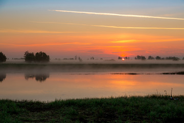 Fototapeta na wymiar Sunrise in the fog