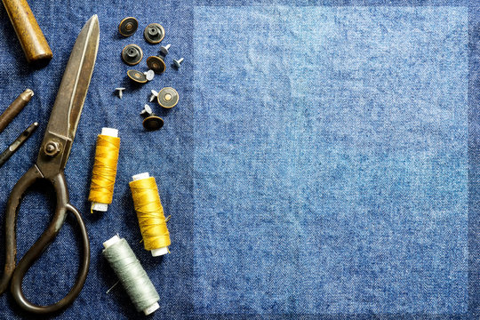 Background sewing equipment of jeans clothes table top view and  empty space for text