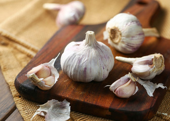 Garlic on vintage wooden board