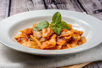 Pasta with tomato sauce and basil