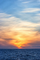 Beautiful sunset at the sea with a weather front