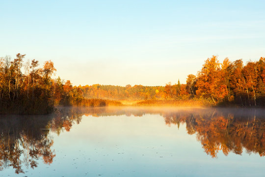 View of a lake at dawn in the autumn