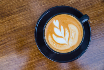 Cappuccino in a cup on the table