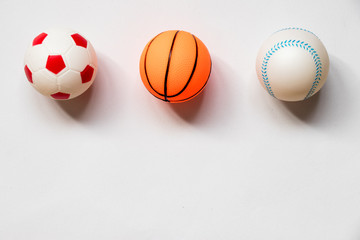 Group of football, baseball and basketball placed on white background
