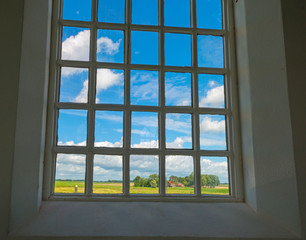 Fototapeta premium Window of an ancient church in sunlight