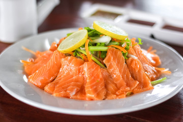 Fresh salmon with vegetable, lemon and sauce