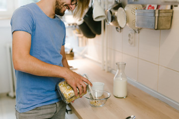 Man having healthy breakfast in his kitchen